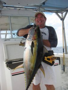 charter fishing client catches tuna