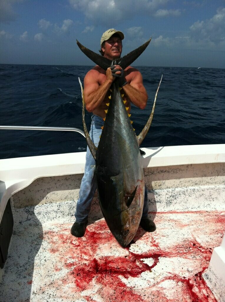 Captain Troy Wetzel holding a large Tuna caught in the Gulf Of Mexico off the Louisiana shores.