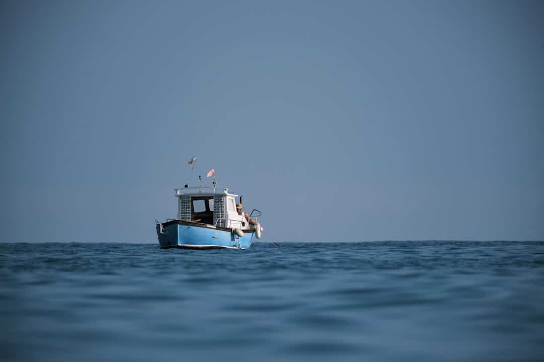 An offshore fishing boat on the open water.